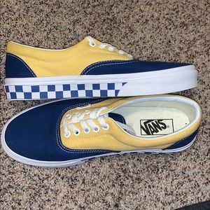 navy blue and yellow vans with checkers on side.